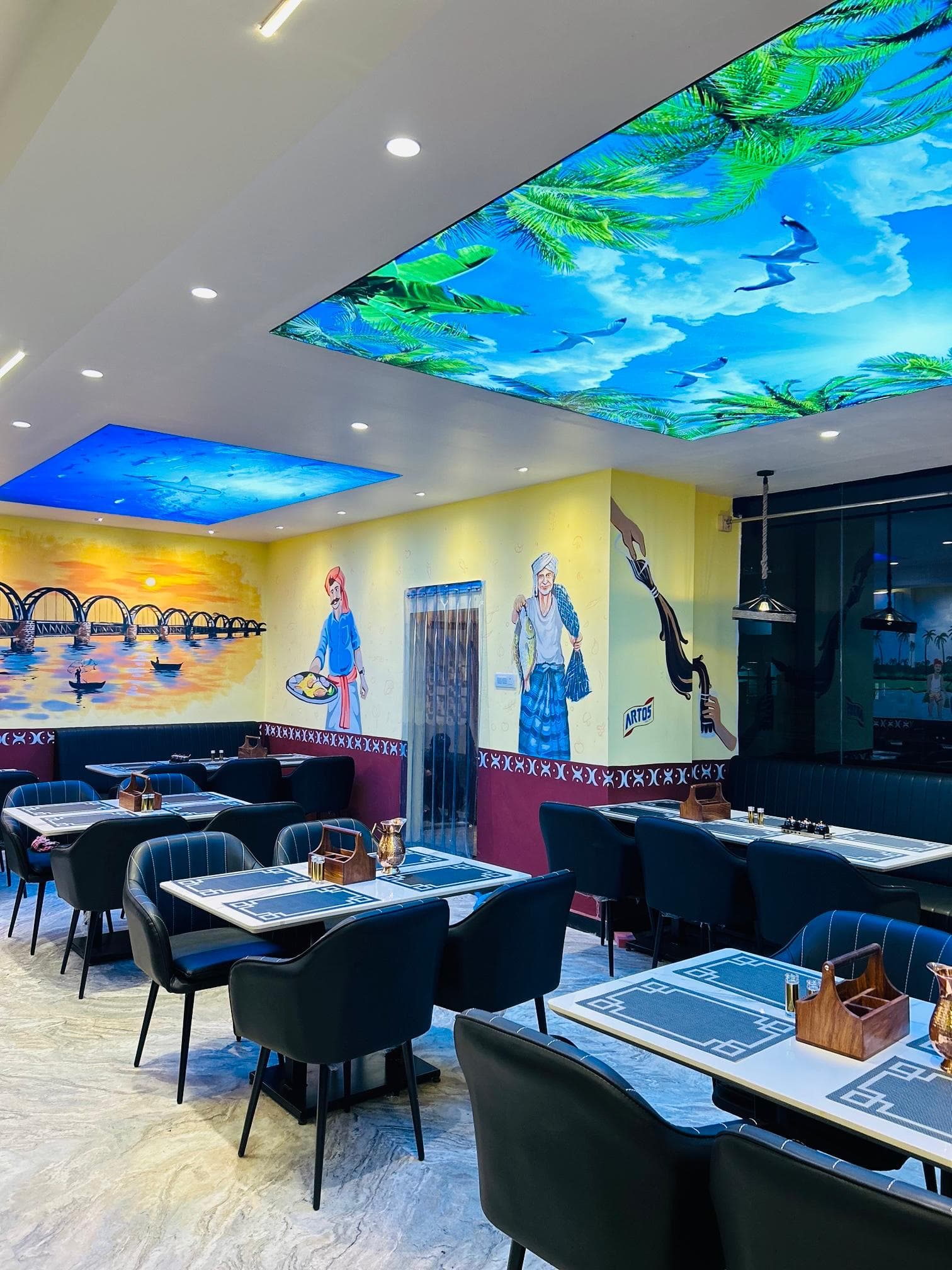 Godavari VVM dining room ambience with wall art and seating